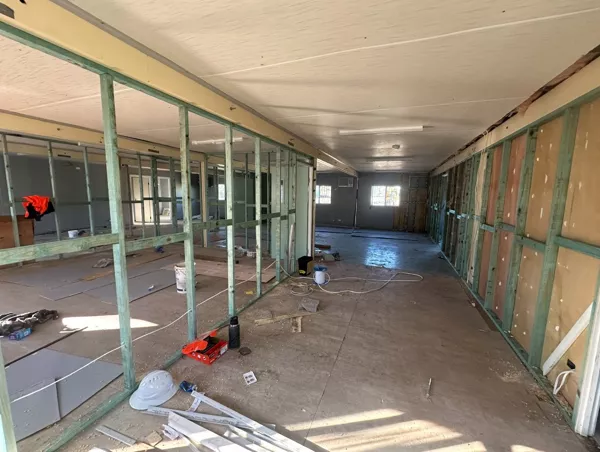 Commercial fit-out in progress with framed partitions and rough-in electrical by NI Installations